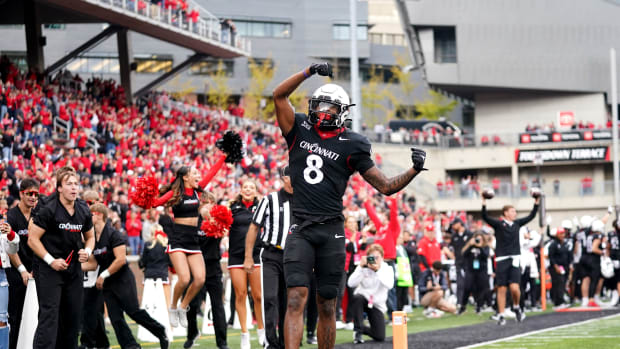 Oct 21, 2023; Cincinnati, Ohio, USA; Cincinnati Bearcats wide receiver Xzavier Henderson (8) celebrates after a touchdown catch against the Baylor Bears in the fourth quarter at Nippert Stadium. Mandatory Credit: Kareem Elgazzar-USA TODAY Sports  
